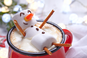 Image of a marshmallow man in a cup of hot chocolate; Shutterstock.